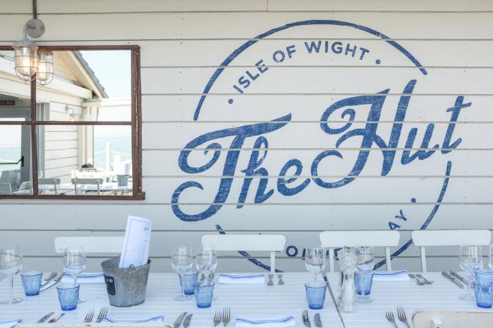 The Hut logo and outdoor seating
