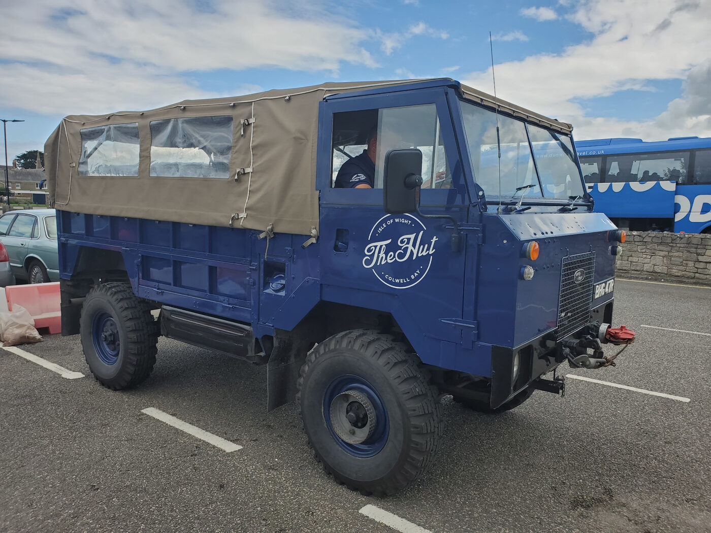 The Hut at Colwell Bay's vintage blue Land Rover used for complimentary guest transfers from Yarmouth